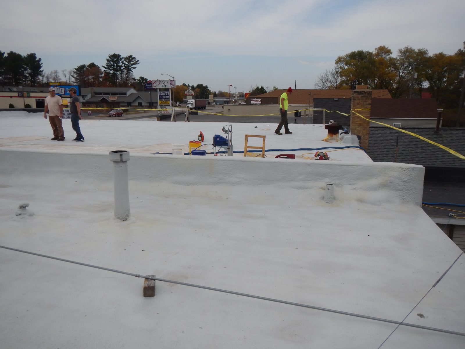 Recoated roof over primed substrate