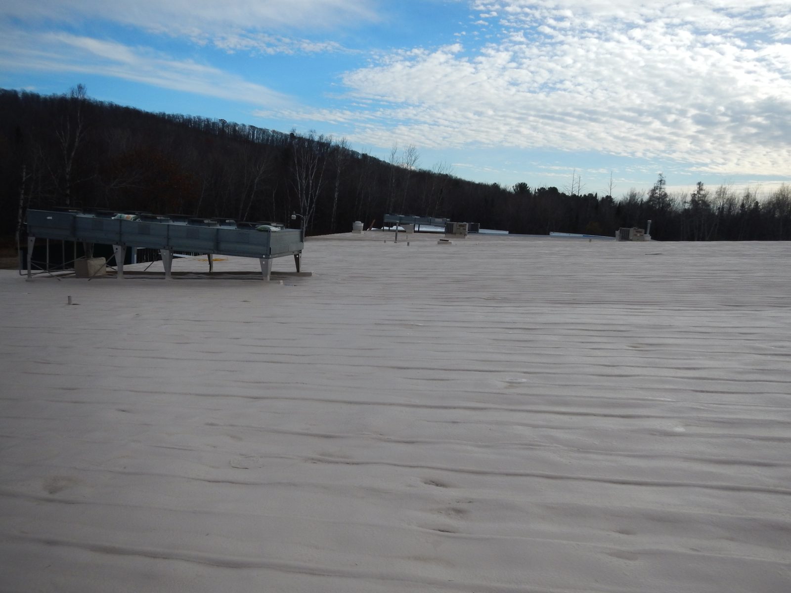 Metal roof restoration with primer system